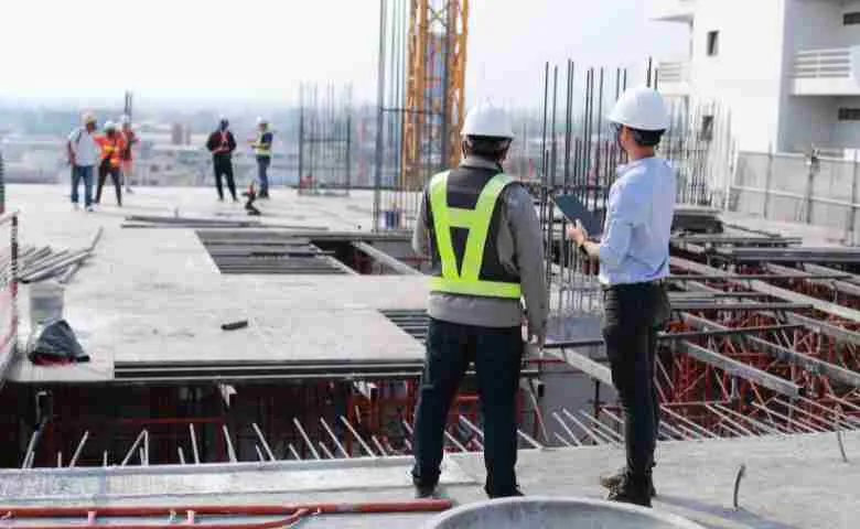Construction worker inspecting building quality