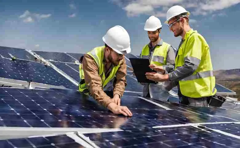 Solar panels installation by technicians representing job opportunities in solar sector