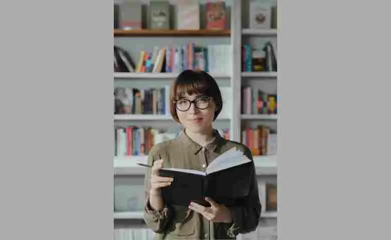 Stylish kitchen with bookshelves filled with cookbooks and novels