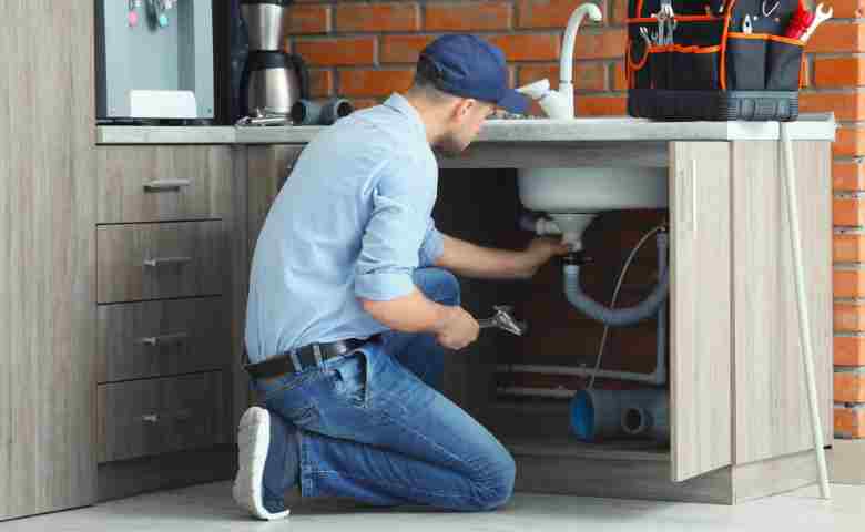 Expert plumber upgrading a home water system