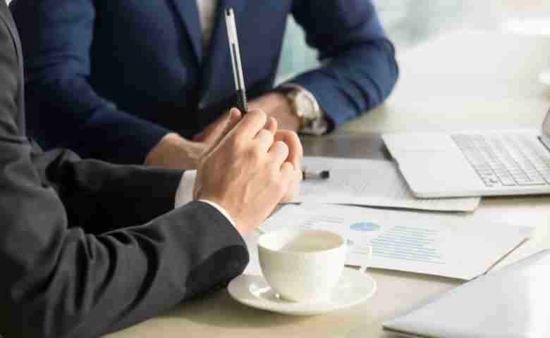 Construction manager negotiating project terms