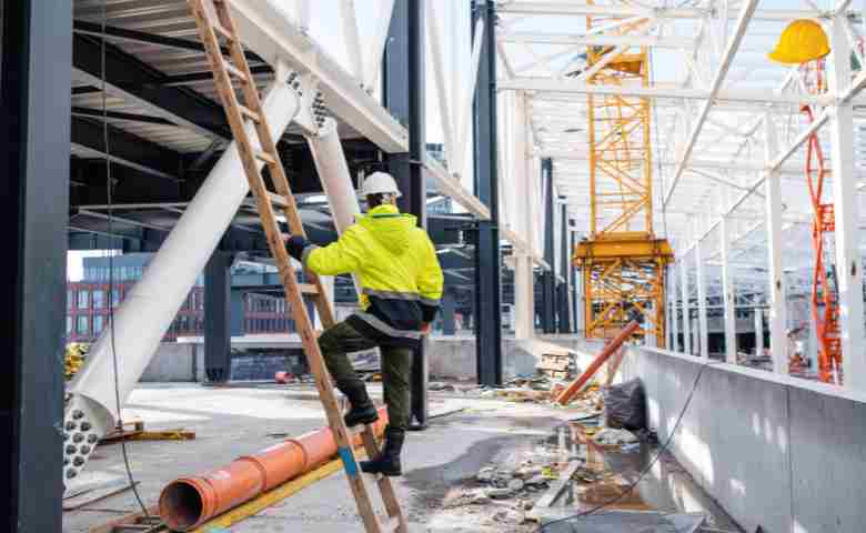 Secure construction site with workers wearing safety gear