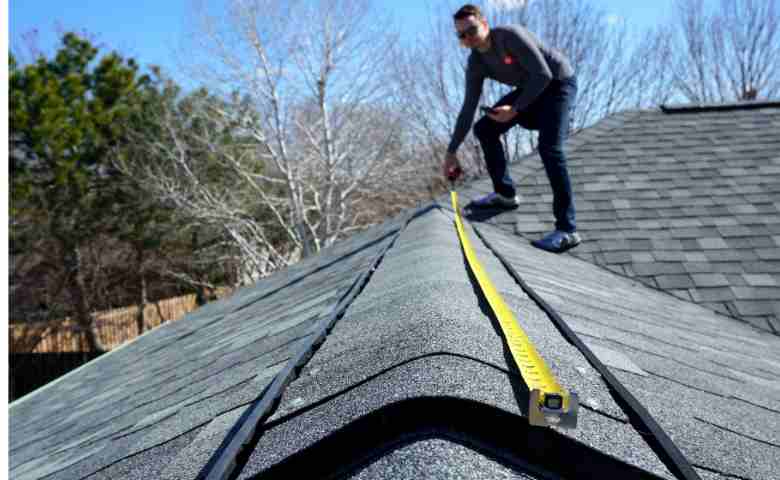 Professional roofer repairing a residential roof in Toowoomba.