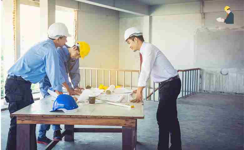 Construction workers with a health and safety consultant on site