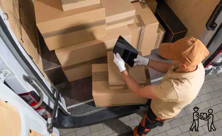 A worker lifting a heavy box incorrectly, highlighting poor manual handling techniques in the workplace.