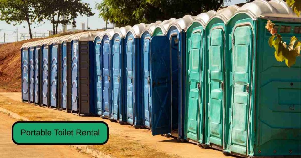 Modern portable toilets set up at a clean and organized construction site with clear signage and safety barriers.