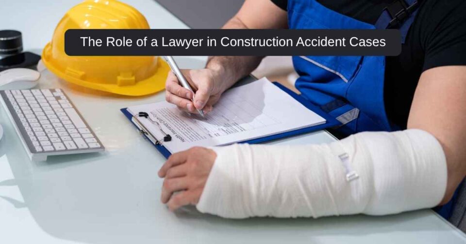 A construction accident lawyer consulting with a client at a legal desk with construction gear in the background.