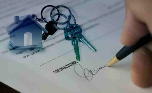 Property manager reviewing rental income reports in a modern apartment complex