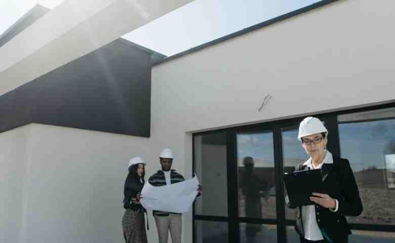 Construction team planning workflow on site with digital tools